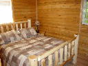 Bedroom on main floor of Alpine Snow Cabin.